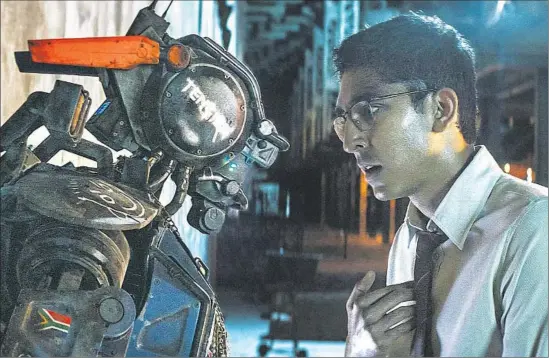  ?? Sony Pictures ?? THE TITLE ROBOT is designed by his maker, played by Dev Patel, to think and feel in Neill Blomkamp’s “Chappie,” which is set in a near-future South Africa.