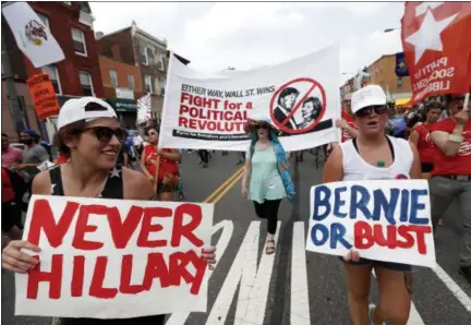  ?? ALEX BRANDON — THE ASSOCIATED PRESS ?? Supporters of Sen. Bernie Sanders, I-Vt., march during a protest in downtown on July 25 in Philadelph­ia, during the first day of the Democratic National Convention.