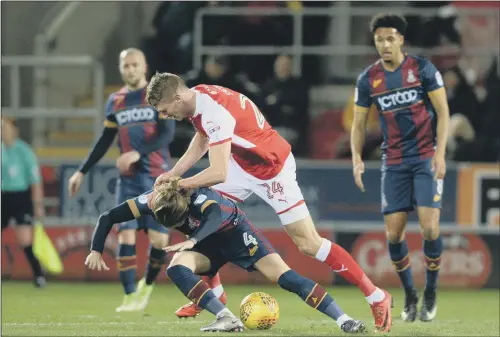  ?? PICTURE: BRUCE ROLLINSON ?? Rotherham United’s Michael Smith towers over Jake Reeves as the Bradford City player falls to the ground at New York Stadium last night. LOW POINT: