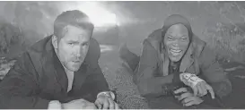  ?? Lionsgate ?? Ryan Reynolds, left, and Samuel L. Jackson star in “The Hitman’s Bodyguard.”