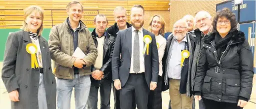  ??  ?? Neil Christian (centre) and other Liberal Democrats on election night