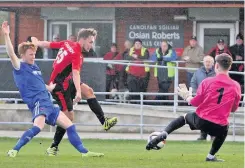  ?? Pictures: RICHARD BIRCH ?? ● GOALS! Porthmadog’s Shaun Cavanagh scores twice against Ruthin