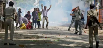  ?? — PTI ?? Students ( above) stage a protest in Ranchi on Monday during “Bharat Bandh” call by dalit organisati­ons against the alleged dilution of SC/ ST Act. Vehicles ( right) set on fire by a group of protesters in Meerut.