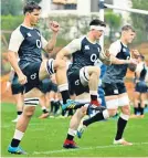  ??  ?? Working hard: Michael Rhodes, Tom Curry and Ted Hill stretch, as they take part in an England training session