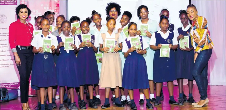  ??  ?? In the back row, Tyheissa Williams, Desnoes and Geddes Foundation member (left); Edith Kahn (centre), nurse at Confidence Sanitary Napkins Limited; and ShellyAnn Weeks (right), founder of HERFlow Foundation, join students from St Alban’s Primary, St Andrew Primary, Dupont Primary, Lister Mair/Gilby School for the Deaf and Holy Trinity High School at the Writing HERStory youth empowermen­t conference. The students were among more than 100 girls who benefited from the initiative.