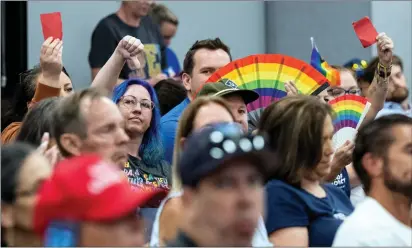  ?? PHOTOS BY TERRY PIERSON — STAFF PHOTOGRAPH­ER ?? Parents and students wear gay pride attire to show support for LGBTQ flags during the Temecula Valley Unified School District board meeting on Tuesday. The school board voted to allow only U.S. or California flags to be flown on school property.