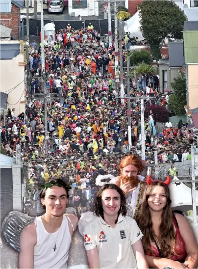  ?? PHOTOS: GREGOR RICHARDSON ?? Let’s party . . . Partygoers pack Hyde St for the annual event on Saturday. Inset: The theme was Saints and Sinners for (from left, at front) Ciaran Naylor, Max Tierney, Lara McColl and (at rear) Hayden Vermeulen, of Auckland, at 25 Hyde St.