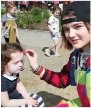  ?? ABOVE: ?? Freya O’Connell having her face painted on Saturday by Nadine Rider at the Down Syndrome Kerry Branch open Day at Ballyseedy Garden Centre.