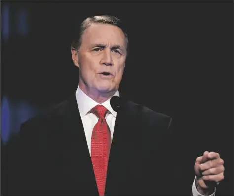  ?? BRYNN ANDERSON/AP ?? Former Sen. David Perdue speaks during a gubernator­ial republican primary debate on May 1, 2022, in Atlanta. Perdue has made election fraud the centerpiec­e of his run for Georgia governor. But if he hopes to win in this year’s midterm elections, his supporters will have to use the same democratic system he says they shouldn’t trust. The only way to win a rigged election, he says, is to turn out in such high numbers that the Democrats can’t get away with cheating.