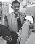  ?? WASEEM ANDRABI /HT ?? ▪ A man carries a student injured when a school bus was attacked by stonepelte­rs, Shopian, Kashmir, May 2