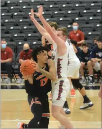  ?? KYLE FRANKO — TRENTONIAN PHOTO ?? Princeton’s Jaelin Llewellyn (13) looks to maneuver around Penn’s George Smith (40) during an Ivy League men’s basketball game at Jadwin Gymnasium on Monday afternoon.