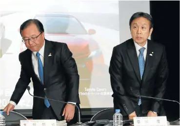  ?? /Reuters ?? New deal: Toyota Motor’s managing officer, Tetsuya Otake, left, and senior managing officer Shigeru Hayakawa attend a news conference in Tokyo, Japan on Monday.