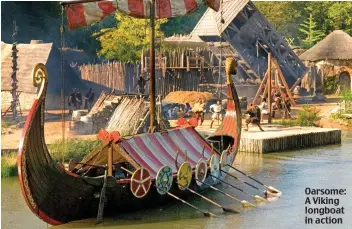  ??  ?? Oarsome: A Viking longboat in action