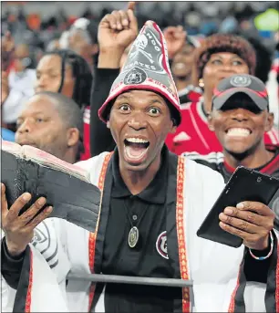  ?? Picture: BRIAN WITBOOI ?? FAITHFUL SUPPORTER: An elated Orlando Pirates supporter relishes his team’s efforts against Chippa United in an Absa Premiershi­p game at Nelson Mandela Bay Stadium last night. Pirates won 1-0.