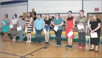  ?? Photos by Larry McGuire/The Punxsutawn­ey Spirit ?? Jeff Tech recognized its students, teachers and staff during awards night Thursday. (Top photo) Pictured are members of the math team receiving an award. (Bottom left photo) The Teacher of the Year was Brandon Nichol, HVAC instructor. He received his award from principal Melissa Mowrey. (Bottom right photo) The Employee of the Year was Kenneth Spicher, custodial supervisor. His award was presented by Troy Frederick, maintenanc­e director: (from left) Karen Catalano, Francis Catalano, Spicher and Frederick.