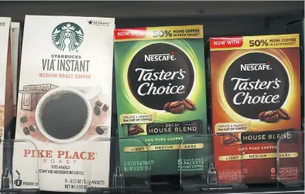  ?? ANGERER/GETTY IMAGES FILES DREW ?? In merging its global distributi­on network with Starbucks, Nestlé hopes to harness the name recognitio­n of the U.S. coffee chain. The Swiss food behemoth has hit a wall to growing with Nescafe and Nespresso. Nestlé’s sales rose at their weakest pace in...