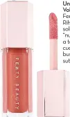  ??  ?? El Gloss Bomb Universal Lip
Volumizer de la línea Fenty Beauty by Rihanna viene en un solo tono rosado “nude” que se ajusta a todo tipo de piel cuando lo que buscas es un estilo sutil.