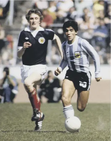  ??  ?? 0 Maradona skips away from Paul Hegarty at Hampden in June 1979