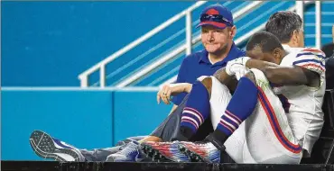  ?? MIKE EHRMANN / GETTY IMAGES ?? Bills running back LeSean McCoy sustained a sprained ankle in the third quarter of the season finale at Miami last weekend and is questionab­le to play at Jacksonvil­le today.