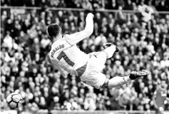  ??  ?? Real Madrid’s Portuguese forward Cristiano Ronaldo controls the ball during the Spanish league football match between Real Madrid and Sevilla at the Santiago Bernabeu Stadium in Madrid on December 9, 2017. - AFP photo