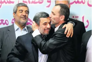  ?? Ebrahim Noroozi / AP Photo ?? Hamid Baghaei, a close ally of former Iranian president Mahmoud Ahmadineja­d, centre, lauds his candidacy for the upcoming presidenti­al elections.