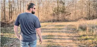  ?? TENNESSEE LOOKOUT PHOTO/JOHN PARTIPILO ?? Hunter Hollingswo­rth, seen at his family's Benton County property, successful­ly sued the Tennessee Wildlife Resources Agency.