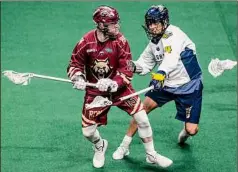  ?? James Franco / Special to the Times Union ?? Albany’s Joe Resetarits, left, makes a move Saturday in front of Georgia’s Lyle Thompson, a former UAlbany standout.