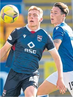  ?? Pictures: SNS. ?? Top: Saints striker Stevie May is challenged by County’s Coll Donaldson; above: Danny McNamara puts pressure on Josh Reid.