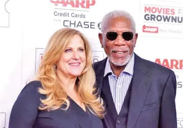  ??  ?? Producer Lori McCreary (left) and actor Morgan Freeman at the Annual Movies for Grownups Awards, February 2016. — AFP file photo