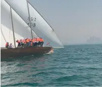  ??  ?? Ahmad Al Rais’s shot of a modern dhow full of sailors out at sea. The photograph­er wants to tell the story of the modern-day dhow.