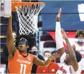  ?? PAUL VERNON AP ?? Illinois guard Ayo Dosunmu (11) goes up for a shot against Ohio State forward E.J. Liddell.