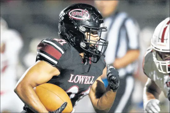  ?? /JOHN SMIERCIAK / POST-TRIBUNE ?? Lowell’s Joey Heuer picks up yards against Kankakee Valley on Friday.