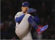  ?? JIM YOUNG — ASSOCIATED PRESS FILE PHOTO ?? Dodgers’ Julio Urias pitches against the Cubs at Wrigley Field in Chicago last month.