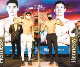  ?? TIM WARNER GETTY IMAGES ?? Ryan Garcia (left) and Luke Campbell pose during weigh-in ahead of their bout today.