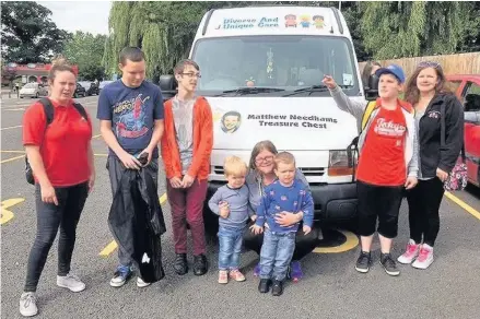  ??  ?? Children and young people who use Diverse and Unique Care in Hinckley, with staff and a parent, in front of the childmindi­ng organisati­on’s upcycled minibus donated by Matthew Needham’s Treasure Chest in memory of the Stoney Stanton schoolboy who died...