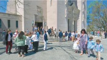  ?? AMY DAVIS/STAFF ?? People leave Cathedral of Mary Our Queen after attending Mass on Easter Sunday.