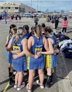  ?? PHOTOS: SUPPLIED ?? Talking tactics . . . Lawrence Area School netballers talk tactics at the South Island secondary schools tournament in Timaru.
