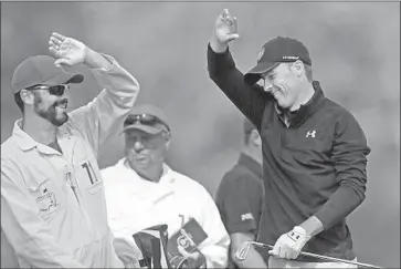  ?? David Cannon Getty Images ?? JORDAN SPIETH reacts on the 12th tee with caddie Michael Greller. Spieth birdied No. 12, the site of his 2016 collapse, and 13, 15 and 16 to tie for the lead. But he bogeyed 18 to finish two shots back despite shooting a 64.