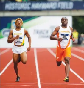  ?? THE ASSOCIATED PRESS ?? Tennessee’s Christian Coleman, right, cruises across the finish line next to Baylor’s Maxwell Willis during a 100-meter dash heat Wednesday at the NCAA Division I outdoor track and field championsh­ips in Eugene, Ore. Coleman’s time of 9.82 seconds set...