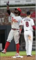  ?? THE ASSOCIATED PRESS ?? Phillies’ Odubel Herrera motions skyward after reaching second base on a double during Tuesday night’s game at the Atlanta Braves.