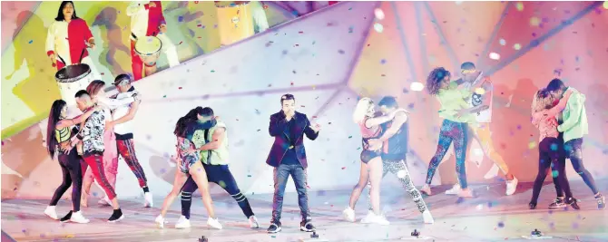  ?? AP ?? Puerto Rico’s singer Luis Fonsi performs during the Opening Ceremony for the Pan American Games at the National Stadium in Lima, Peru, Friday, July 26.