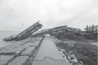  ?? Steve Gonzales/Houston Chronicle via AP ?? The University of Texas at Austin’s Marine Science Institute research pier that was destroyed by Hurricane Harvey is shown Dec. 7 in Port Aransas, Texas. Harvey sent the institute’s researcher­s to other areas of the state.