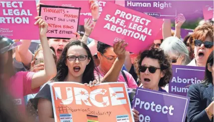  ?? JACK GRUBER/USA TODAY ?? Protesters rally against state abortion bans May 21 on the steps of the Supreme Court.