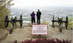  ?? STAFF PHOTO BY C.B. SCHMELTER ?? A couple takes in the sights from Point Park on Lookout Mountain recently. Local efforts to attract retirees cite the area’s affordable cost of living, natural beauty and low tax burden.
