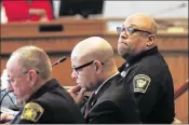  ?? JOHN MINCHILLO / AP ?? Cincinnati Police Chief Eliot Isaac (right) listens during a committee meeting Monday to discuss the shooting at the Cameo nightclub. Isaac said it doesn’t appear there is video footage of the deadly incident.