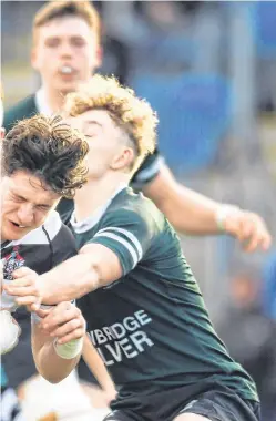  ?? EÓIN NOONAN/ SPORTSFILE ?? Belvedere College’s Matthew Gregan is tackled by Jack Doyle and Sam Cahill of Newbridge College during their Leinster Schools Senior Cup clash, which Belvedere won 31-7