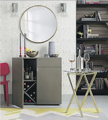  ?? CB2 ?? CB2’s Novo acrylic folding table fits into tight spaces.