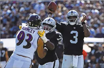  ?? JOSE CARLOS FAJARDO — STAFF PHOTOGRAPH­ER ?? Raiders quarterbac­k EJ Manuel looks to pass against the Baltimore Ravens in the first quarter on Sunday.