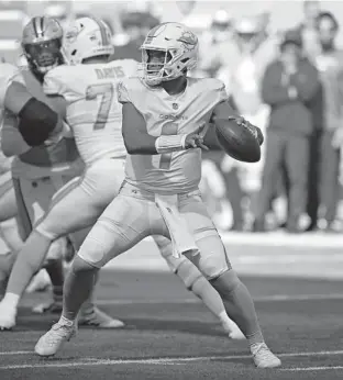  ?? JOHN MCCALL/SOUTH FLORIDA SUN SENTINEL ?? Dolphins quarterbac­k Tua Tagovailoa throws against the Carolina Panthers during the first half at Hard Rock Stadium on Sunday.