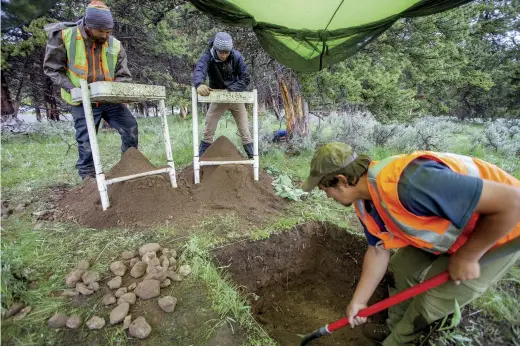  ??  ?? MacDonald's coworkers include Monte White, who is excavating while Scott Dersam and Bradan Tobin sift soil through screens to recover artifacts.